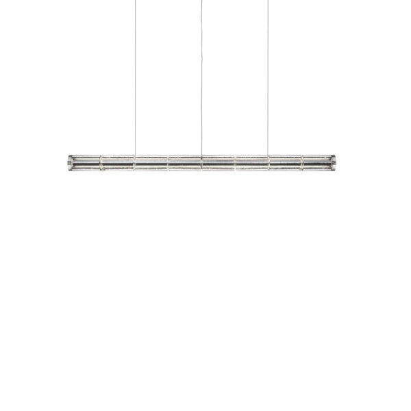 Luce Orizzontale S1 pendant: elongated bar of interconnected cylindrical glass modules suspended by slim clear cables above a dining table.