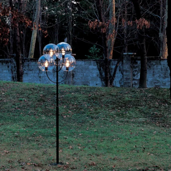 “Lyndon by Oluce modern Italian table lamp – elegant spherical glass diffuser with polished metal base and minimalist design”