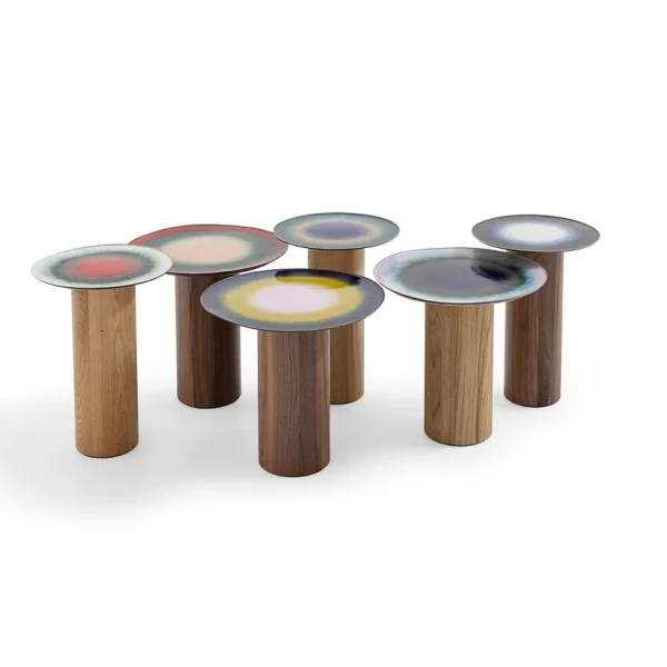 Fire Eater Small Table by Moroso showcasing unpredictable multi‐hued vitreous powder enamel on copper and walnut cylindrical support at the Michigan Design Center