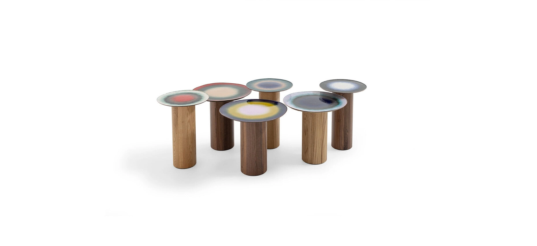 Fire Eater Small Table by Moroso showcasing unpredictable multi‐hued vitreous powder enamel on copper and walnut cylindrical support at the Michigan Design Center