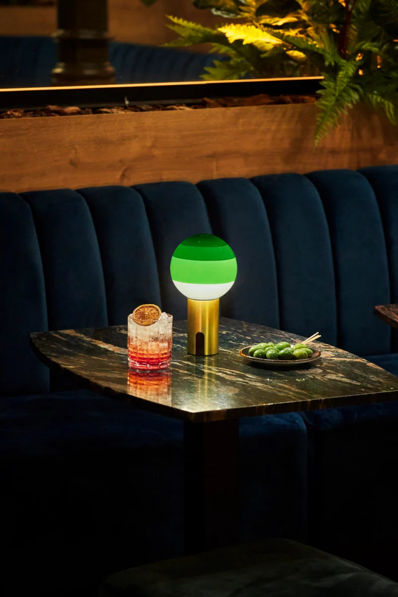 “Ambient lighting Dipping Light by Marset – iconic design with rich gradient hues and clean form”