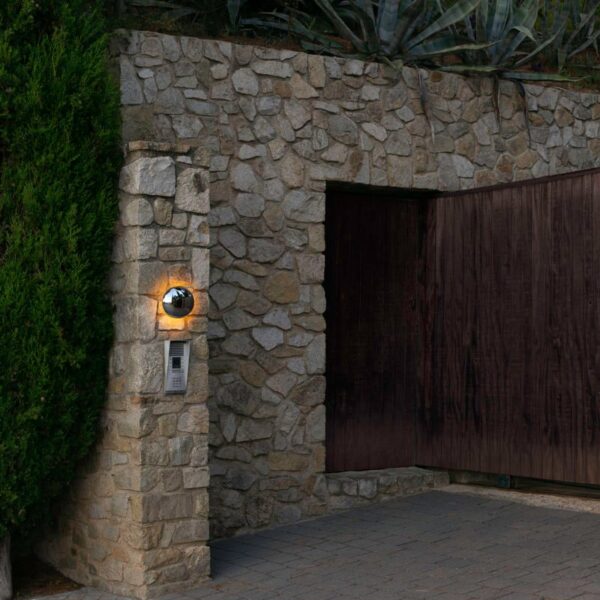 “Babila by Marset sculptural outdoor wall lamp – modern design with mirrored steel and soft illumination”