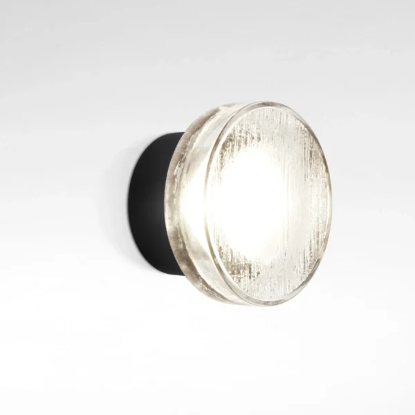 “Roc by Marset wall lamp – compact aluminum fixture with pressed glass diffuser featuring organic, ice‑like texture”