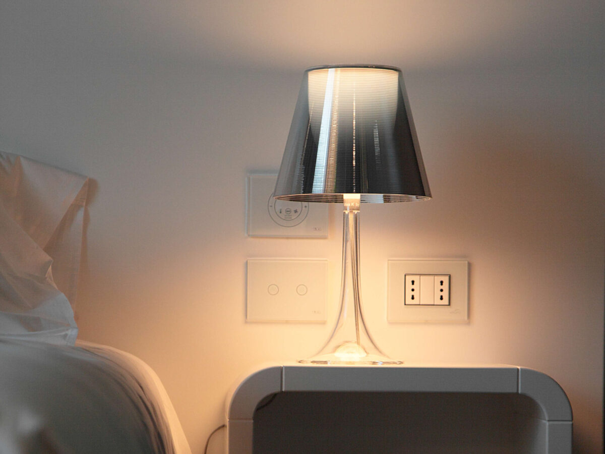 Close-up of the Miss K lamp by Flos, highlighting the elegant dual-shade construction and chrome base.