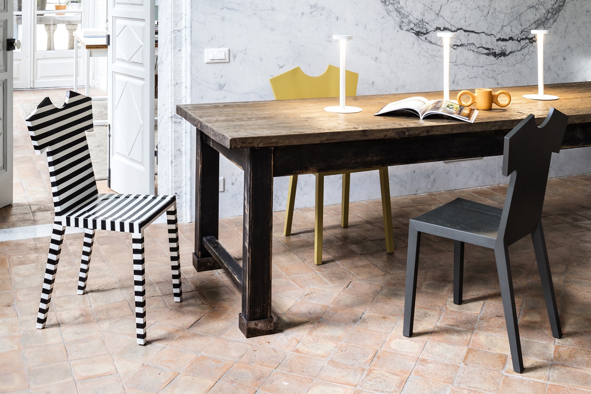 “T-CHAIR by Mogg – sleek designer chair ideal for dining rooms, offices, or gallery spaces”