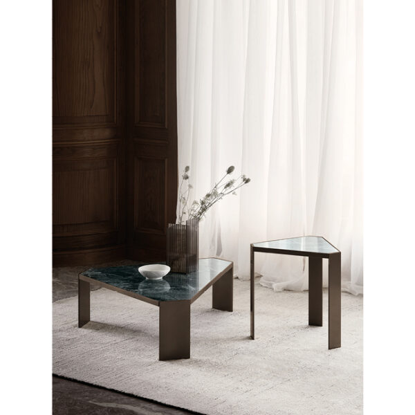 Fly Small side table by Nicoline Italia featuring a minimalist double K metal base and circular top, available in Satin Brass, Antique Bronze, or Mastice finishes.
