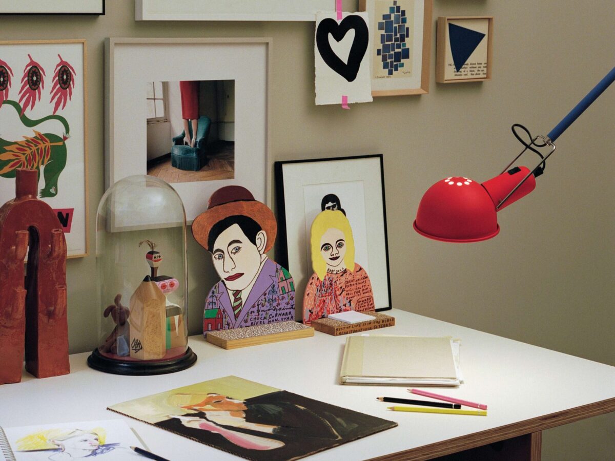 A striking Flos 265 Chromatica wall light, featuring a long, movable blue arm, a bright red lamp head, and a distinct yellow counterweight, perfect for task lighting or a statement piece.