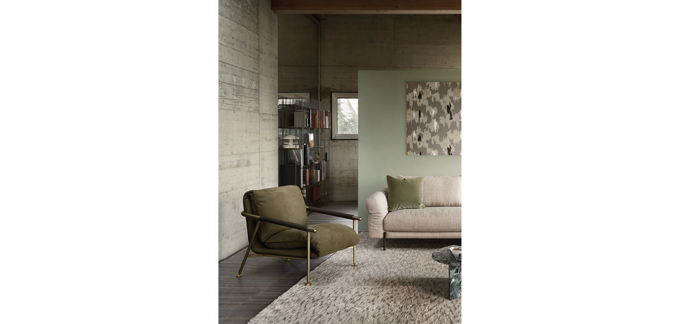 Nicole armchair by Nicoline, featuring a slender metal frame and eco-leather cord armrests, adding modern elegance to interiors in Royal Oak, Michigan.