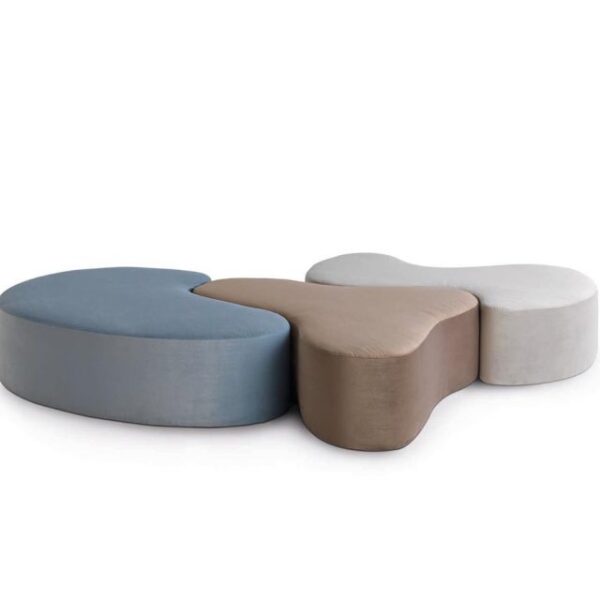 "Set of Nina, Pinta, and Santa Maria stools by Casamania in vibrant red, blue, and yellow finishes, displayed in a modern interior."