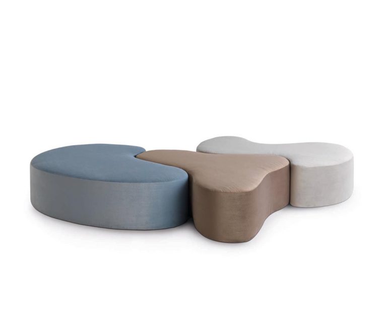 "Set of Nina, Pinta, and Santa Maria stools by Casamania in vibrant red, blue, and yellow finishes, displayed in a modern interior."