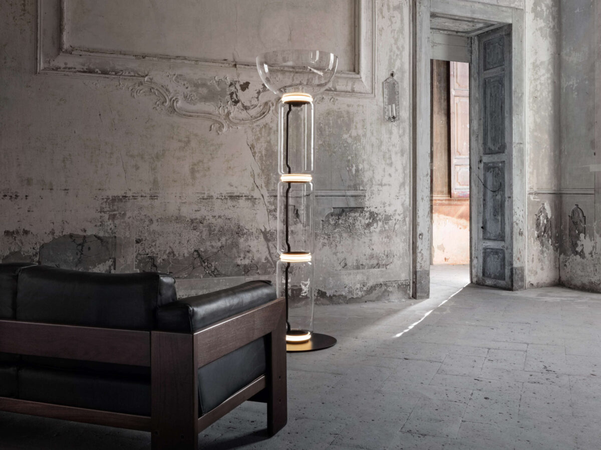 Konstantin Grcic-designed Noctambule floor lamp illuminating from LED rings between high glass modules and bowl top
