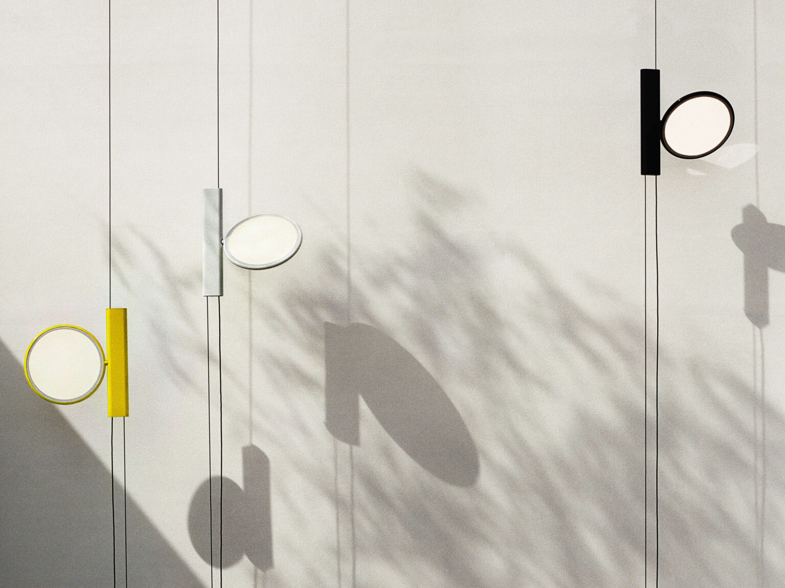 Close-up of the OK pendant lamp's LED head, demonstrating its edge-lighting technology and 360° adjustability.