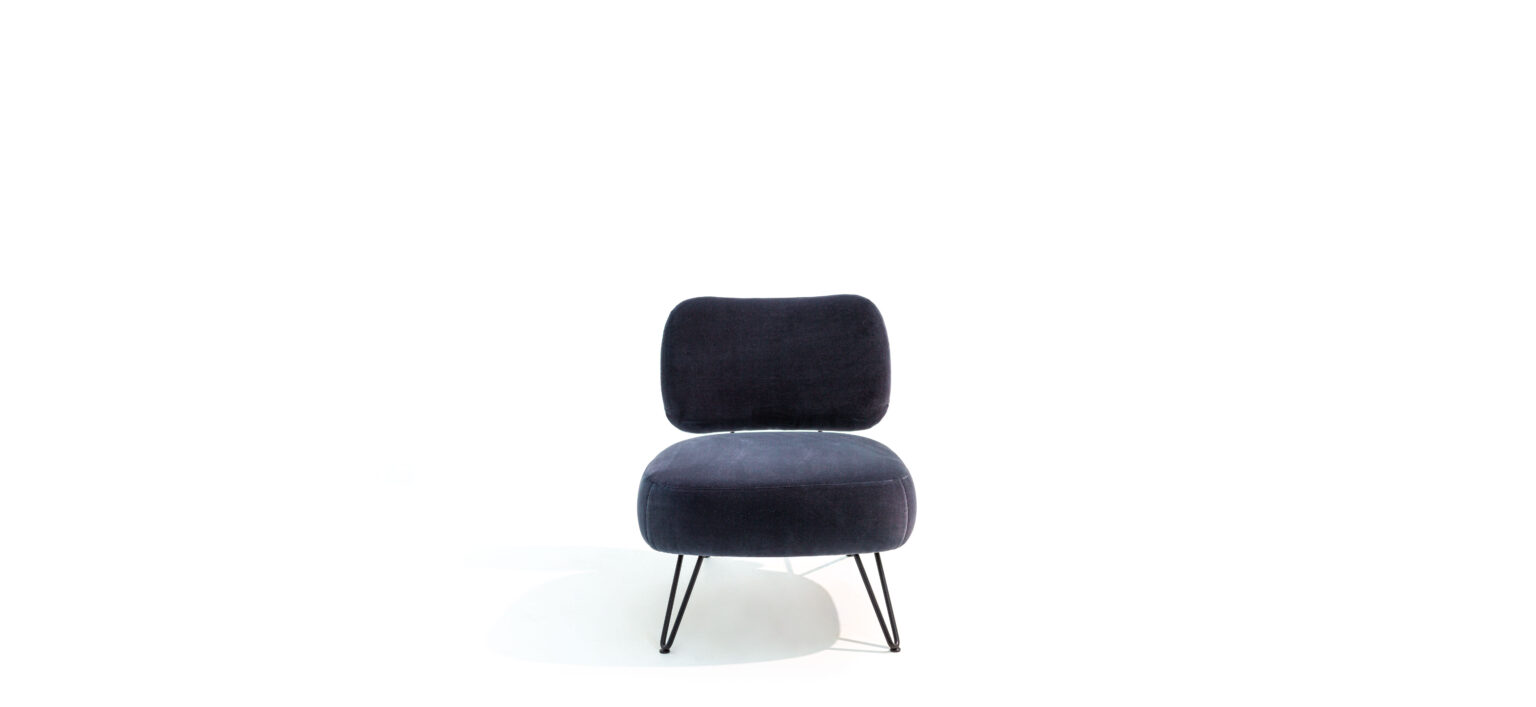 “Overdyed armchair by Moroso – contemporary Italian designer chair with vibrant upholstery and sleek modern design”