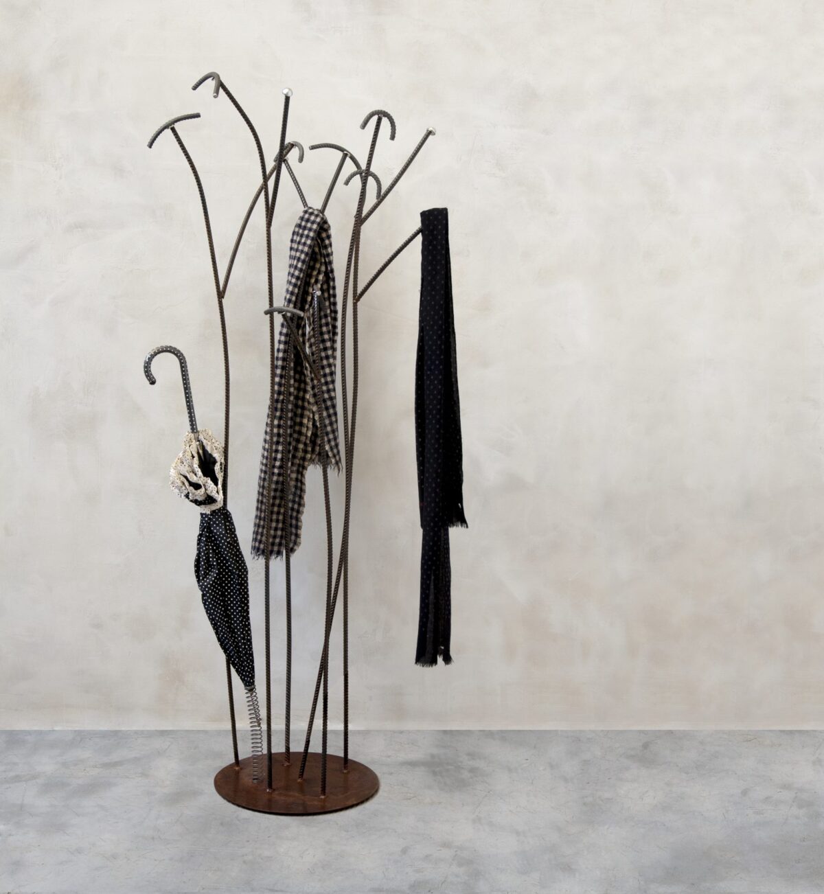 Sculptural coat rack with branching steel arms by Zeusnoto.