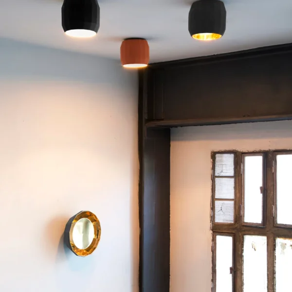“Scotch Club by Marset stylish suspended light – faceted ceramic craftsmanship with soft illumination”