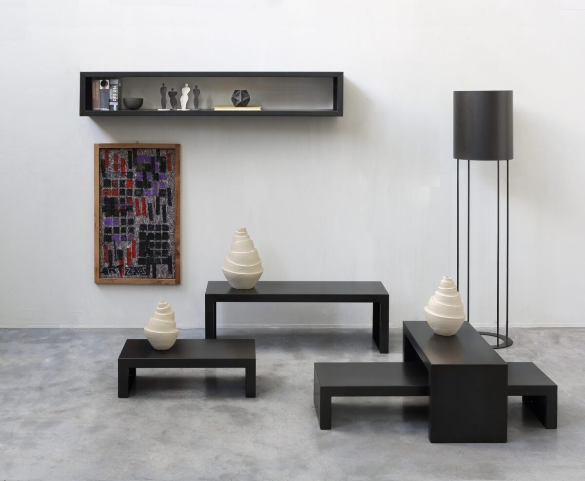 Minimalist wall rack with open steel frame by Zeusnoto.