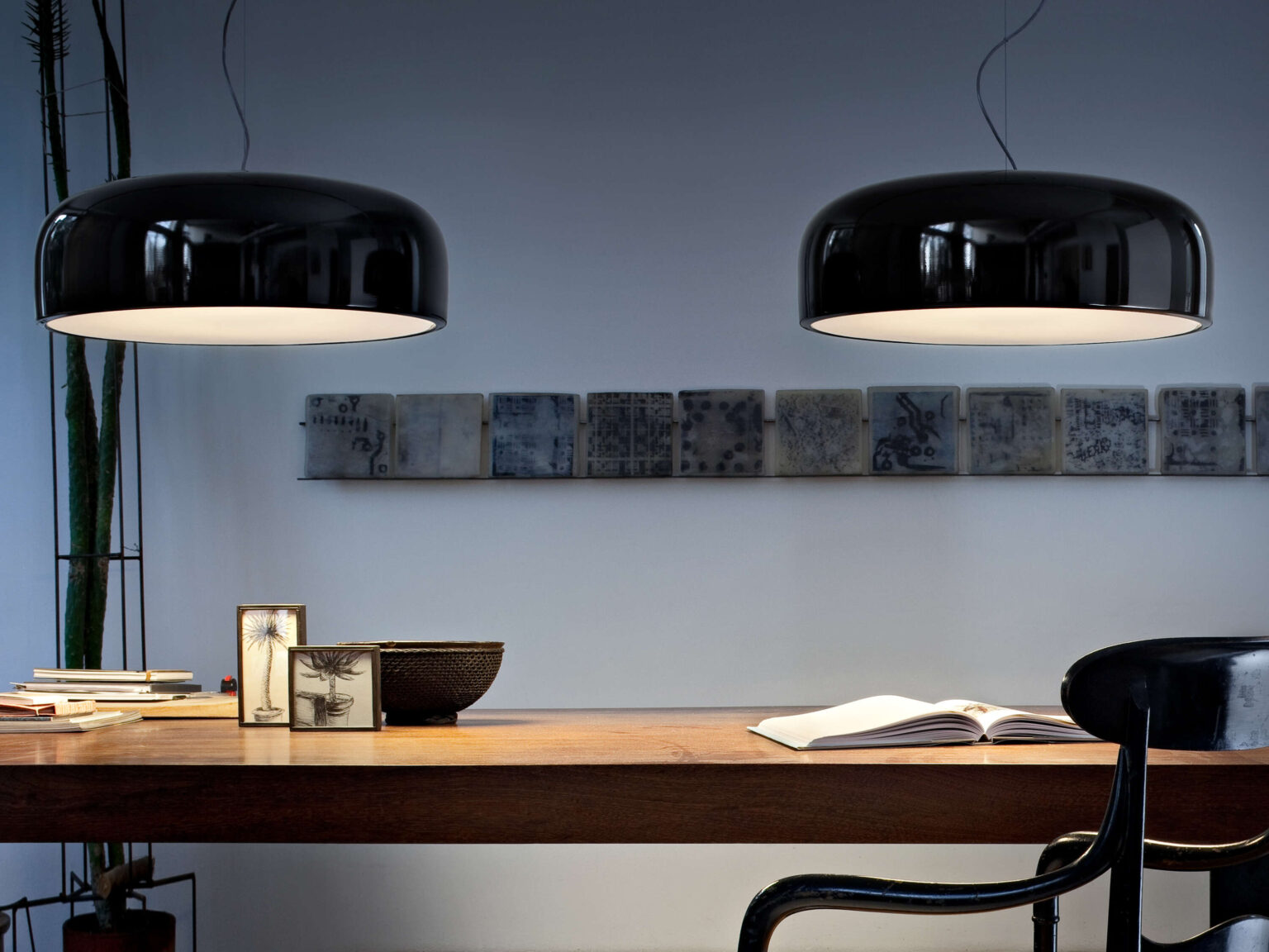 Minimalist Smithfield S Pro pendant in white, illuminating a long conference table in a bright, modern room.