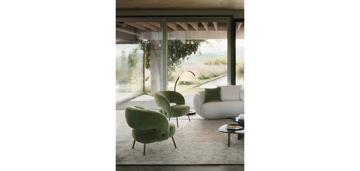 Soufflé armchair by Nicoline, featuring a curved silhouette and eco-friendly foam, adding retro elegance to interiors in Royal Oak, Michigan.