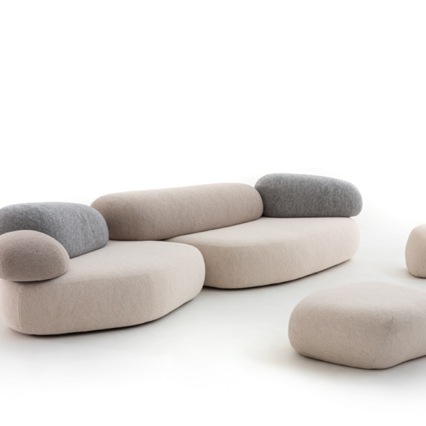 Modern sculptural sofa with a low, earthy silhouette, Pebble Rubble by Moroso arranged in a curved formation.