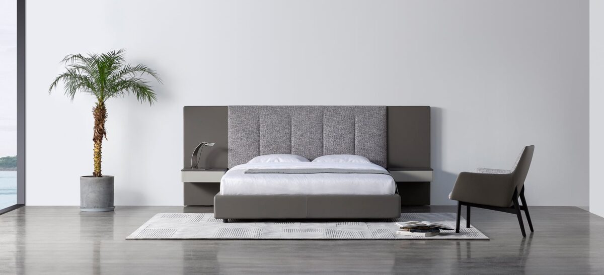 Spacious upholstered bed with wide headboard and contemporary design by Camerich.