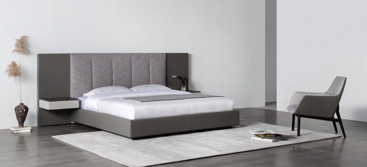 Spacious upholstered bed with wide headboard and contemporary design by Camerich.