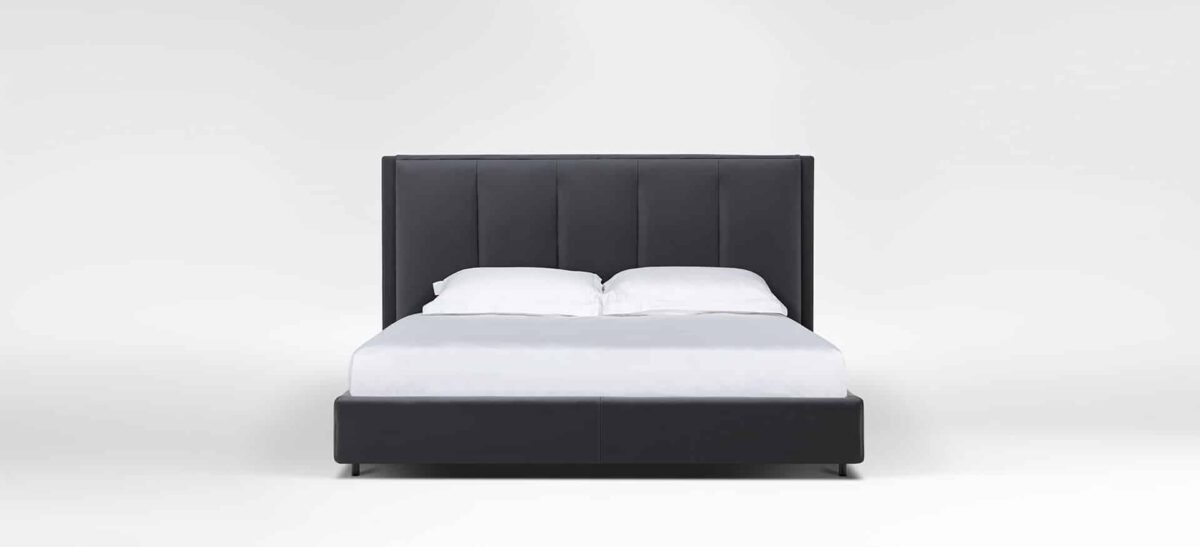 Modern narrow bed with soft, padded headboard by Camerich.