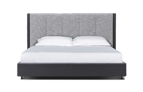Sleek narrow upholstered bed with minimalist frame by Camerich.