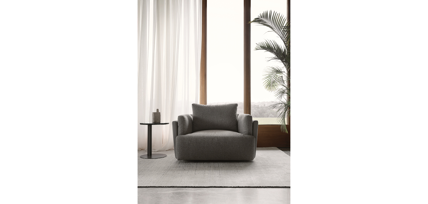 Sunset armchair by Nicoline, featuring a minimalist design with plush cushions, adding modern elegance to interiors in Royal Oak, Michigan.