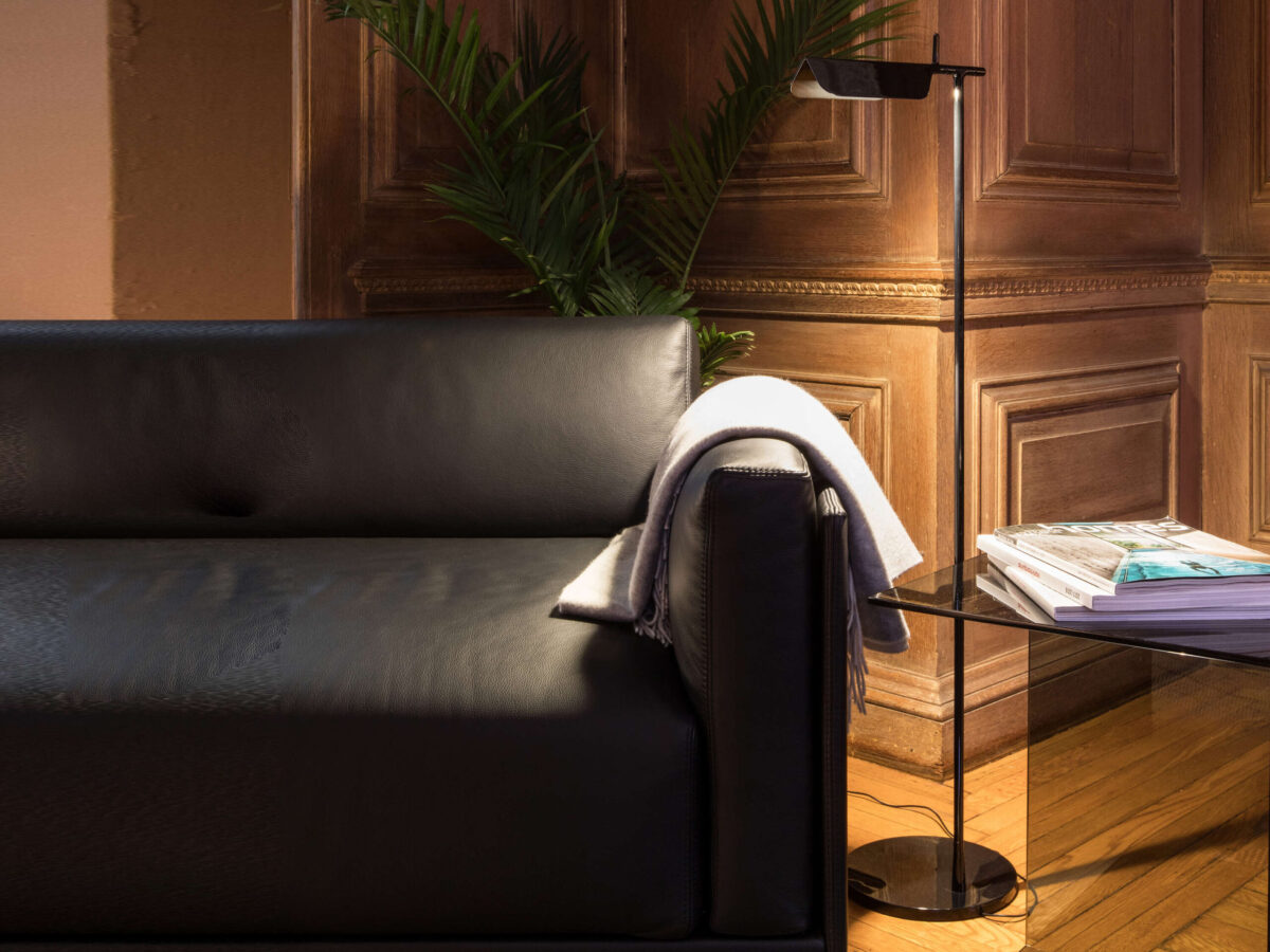 Matte dark green Tab Floor lamp standing tall at 110 cm with a ±90° swivel head, placed in a modern living area.