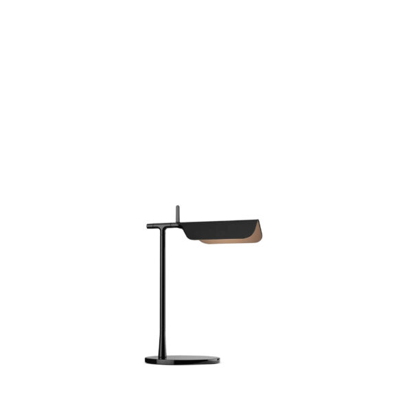 Tab Table by Flos, Minimalist black Tab Table lamp by Flos with a pivoting head, placed on a modern white desk.