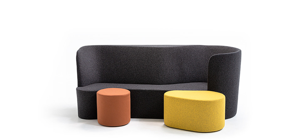 Rounded Taba pouf in burnt orange fabric with smooth cylindrical shape and black polypropylene feet