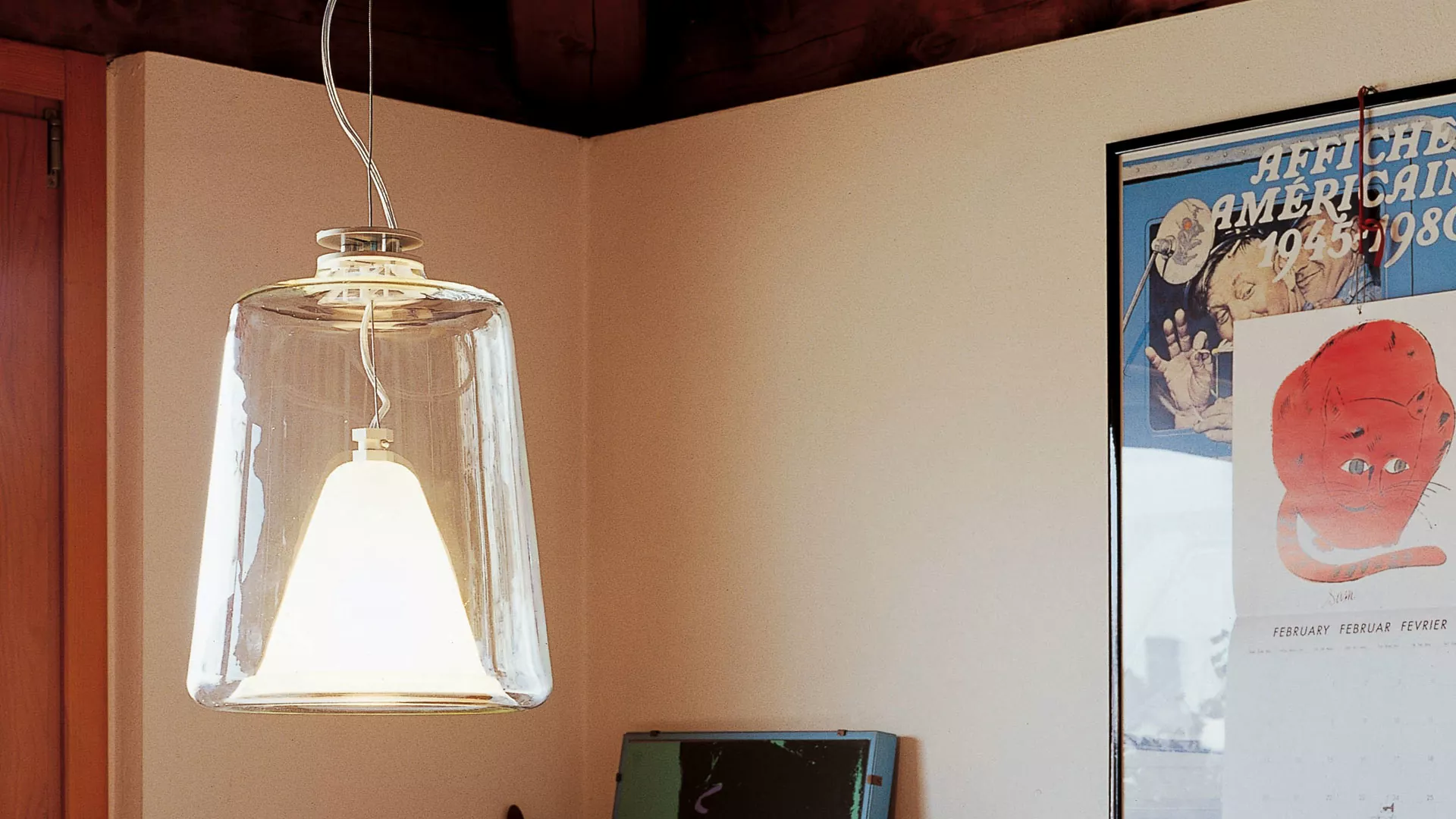 “Lanterna by Oluce modern Italian lantern-style table lamp – elegant glass enclosure with metal frame and warm ambient light”