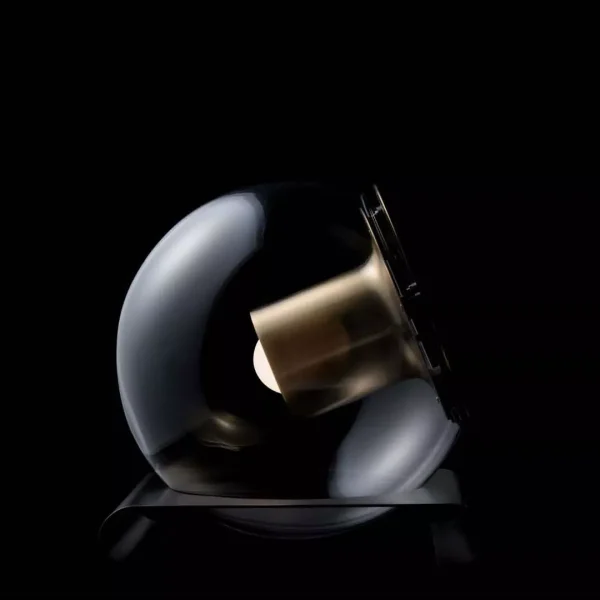 “The Globe by Oluce modern Italian table lamp – transparent glass sphere with suspended inner diffuser and chrome base”