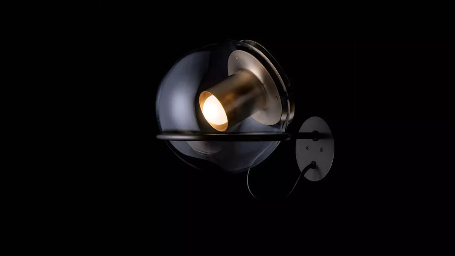 “The Globe by Oluce contemporary designer lighting – elegant globe-shaped lamp featuring polished metal accents and soft ambient light”