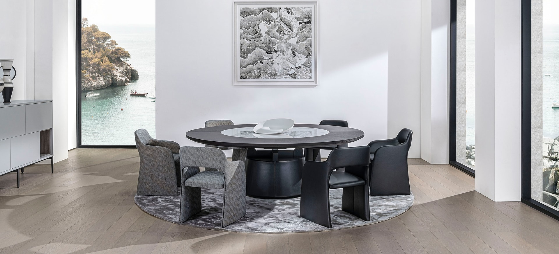 Large dining table with sleek wood surface and minimalist metal legs by Camerich.