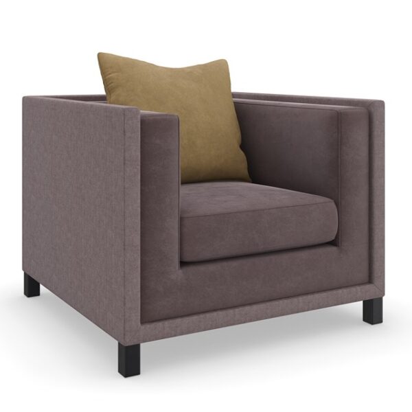 The "Tuxedo Chair by Caracole" is a classic shelter arm chair, distinct from the "Tuxedo Armless Chair" which is typically a modular component for sectionals. The "Tuxedo Chair" features defined arms, offering a more traditional armchair silhouette.