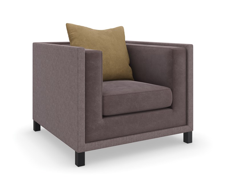 The "Tuxedo Chair by Caracole" is a classic shelter arm chair, distinct from the "Tuxedo Armless Chair" which is typically a modular component for sectionals. The "Tuxedo Chair" features defined arms, offering a more traditional armchair silhouette.