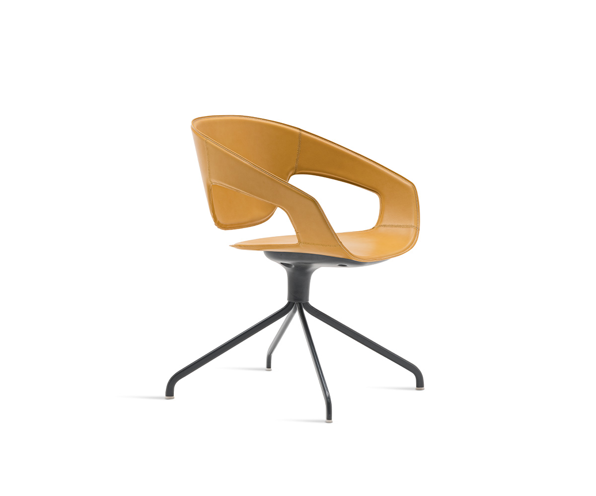 "Vad Swivel Upholstered Chair by Casamania with curved back and soft grey fabric, set on a sleek swivel base."