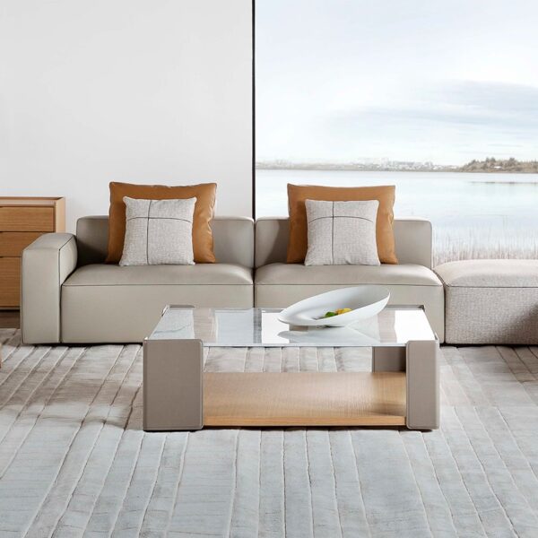 Elegant upholstered chair with curved backrest and sleek legs by Camerich.