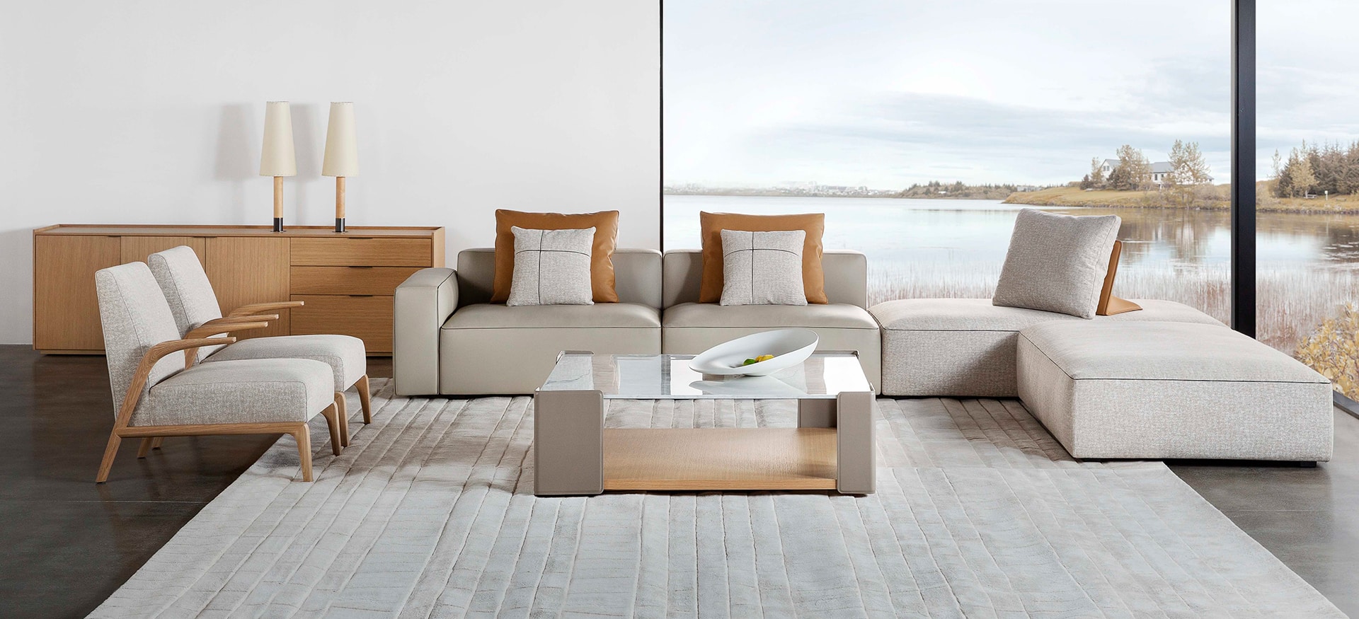 Elegant upholstered chair with curved backrest and sleek legs by Camerich.