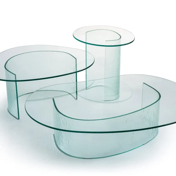 Lakelet Coffee Table by Moroso featuring an irregular tempered glass top with watercolor-like motif and curved base, front view in a Royal Oak Michigan showroom