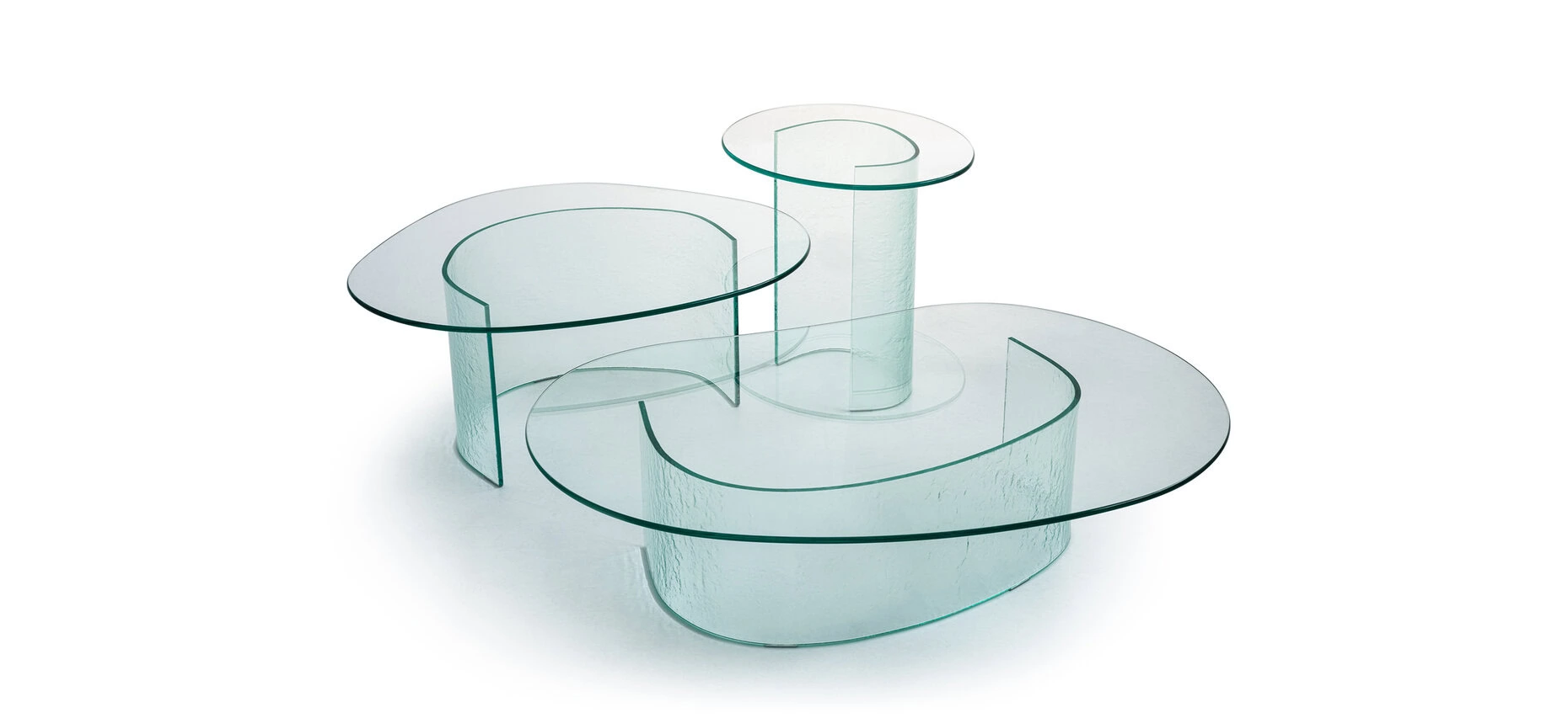 Lakelet Coffee Table by Moroso featuring an irregular tempered glass top with watercolor-like motif and curved base, front view in a Royal Oak Michigan showroom