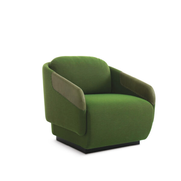"Worn pouf by Casamania in distressed grey fabric, offering casual and cozy seating in a living room."