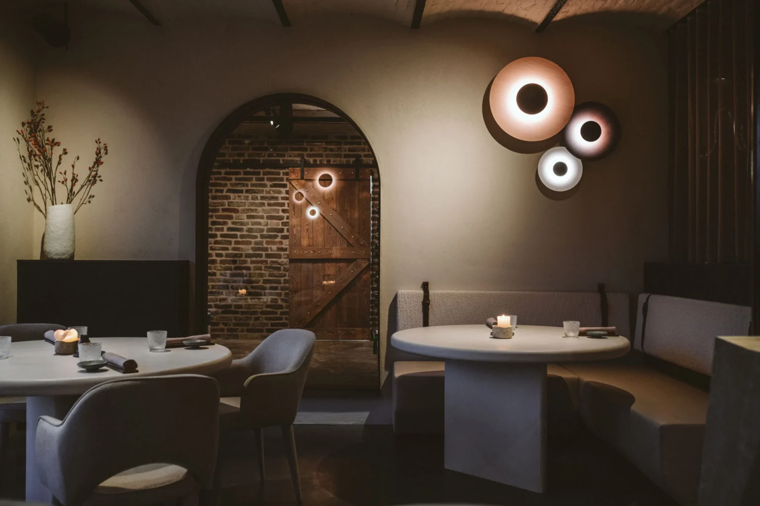 “Ginger by Marset elegant wooden wall lamp – natural tones creating cozy atmosphere”