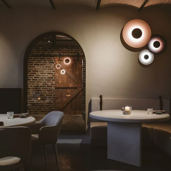 “Ginger by Marset elegant wooden wall lamp – natural tones creating cozy atmosphere”