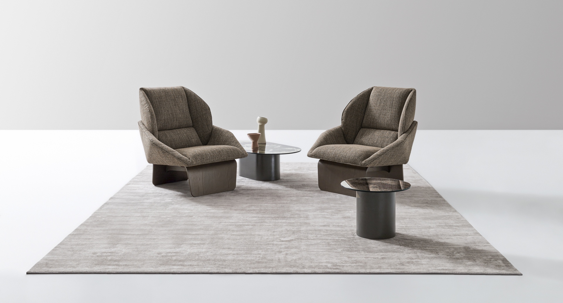 “Loto armchair by Ditre Italia – contemporary Italian lounge chair with curved backrest and minimalist silhouette”