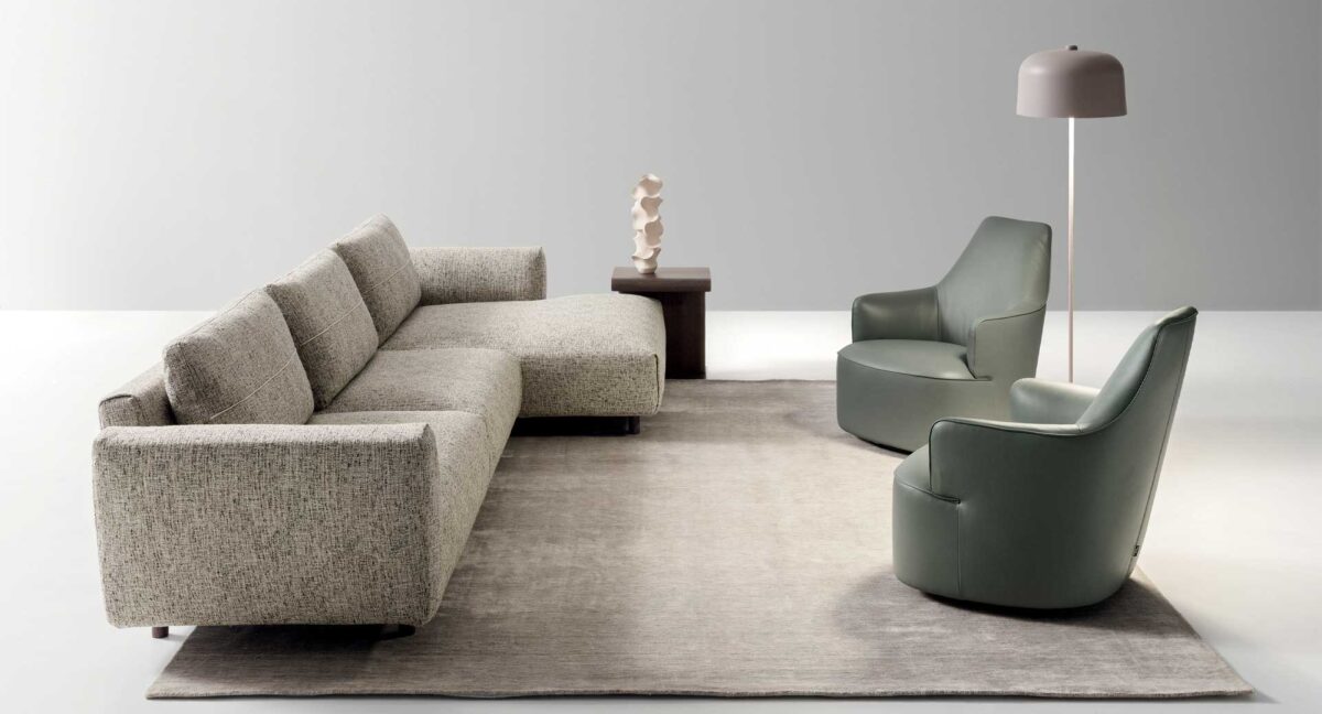 “Modern Atlantis sofa by Ditre Italia – stylish and versatile seating with premium fabric and sleek armrests”