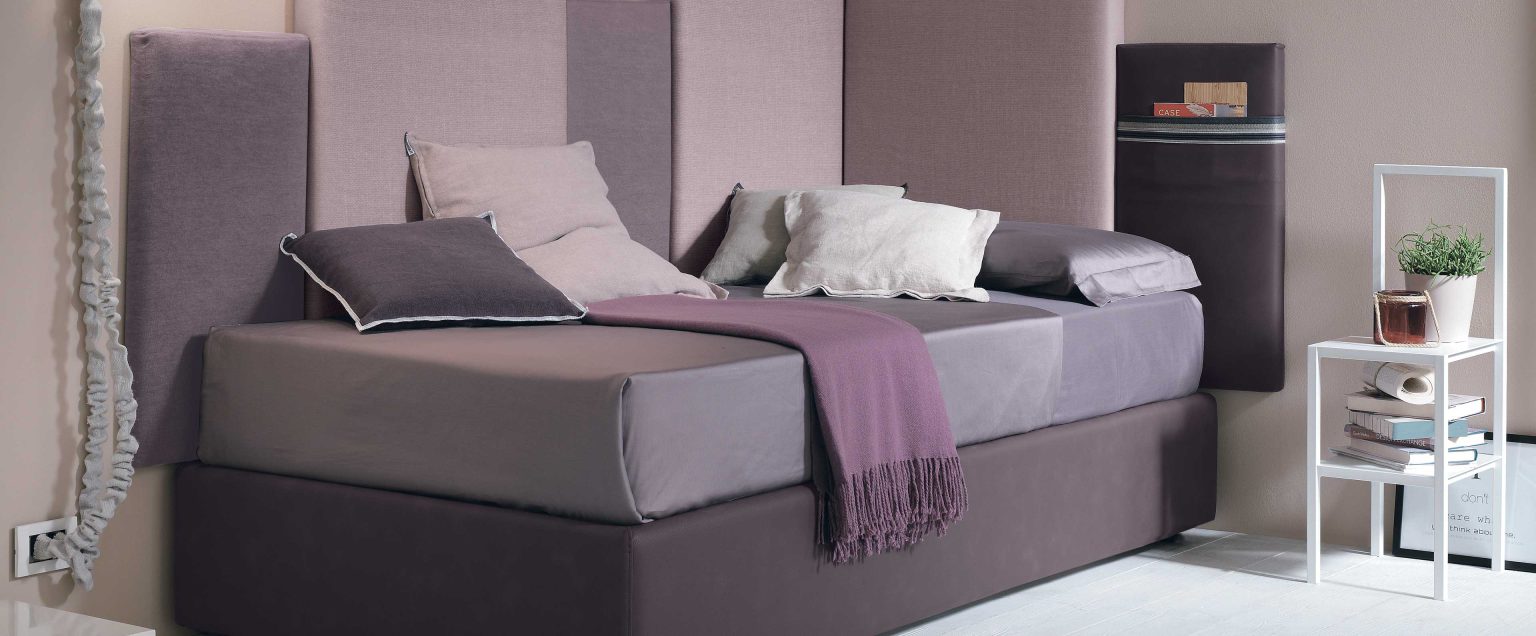 “Corner single bed by Tomasella – modern Italian single bed with wraparound upholstered headboard for corner placement”