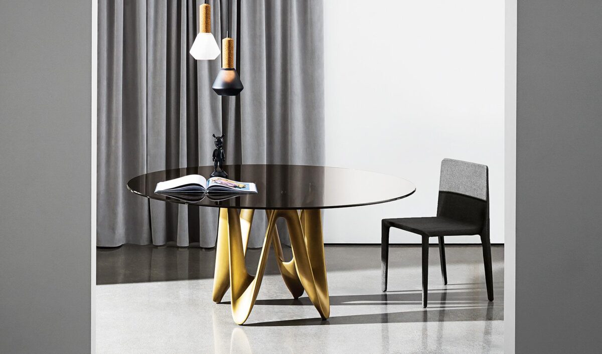 “Modern designer dining table – Lambda by Sovet with curving central base and elegant surface”
