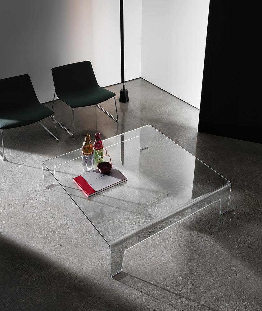 “Sovet Frog – contemporary all-glass table featuring fluid lines and minimalist monolithic form”